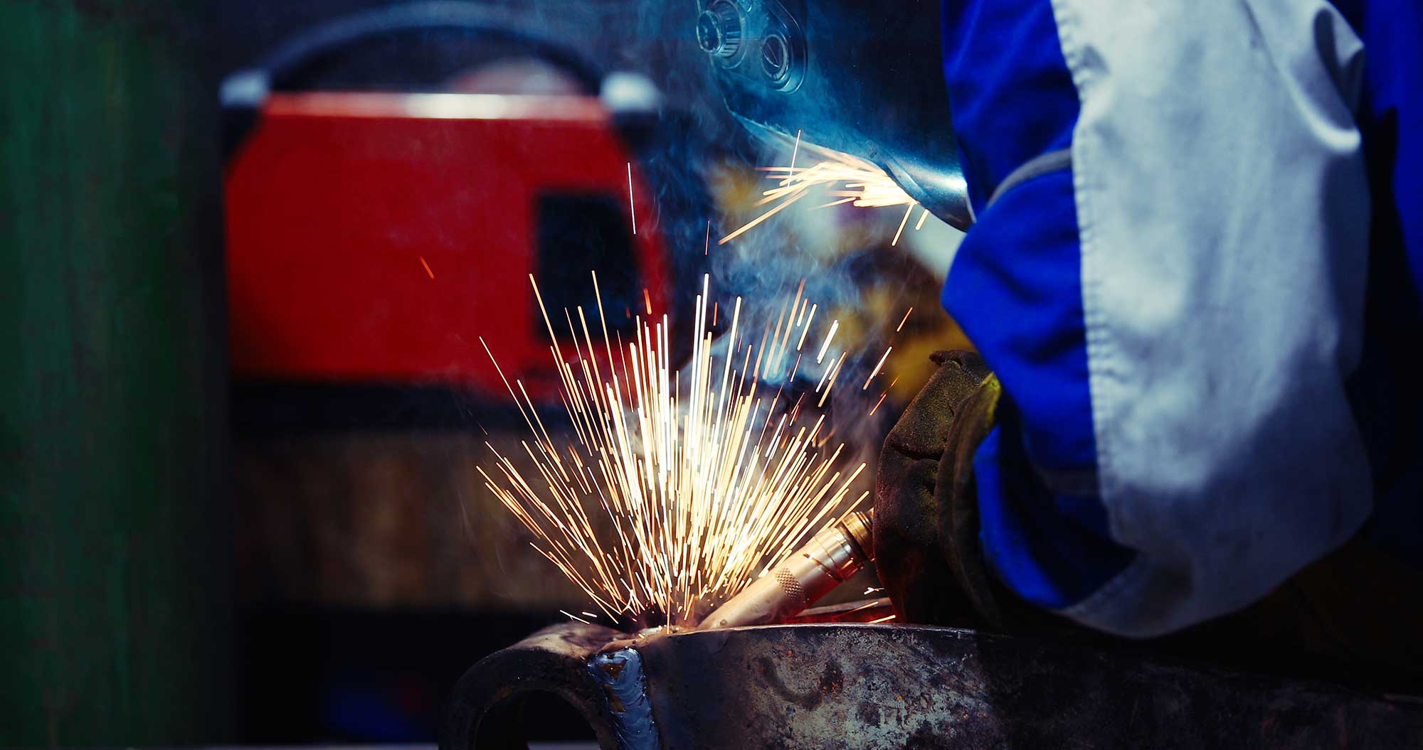 man-welds-at-the-factory-working-in-metal-industry-2025-03-14-16-19-21-utc