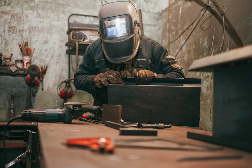 worker-in-a-welder-mask-works-in-a-workshop-for-we-2024-10-18-13-34-47-utc